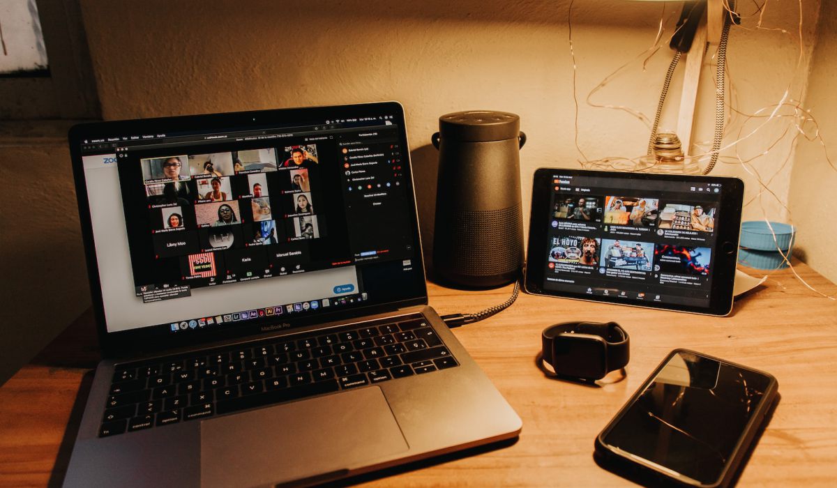 black and silver laptop computer on brown wooden table